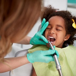 Sedated child receives dental cleaning?