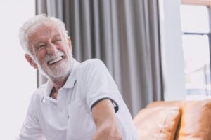 Older man talking in dentures