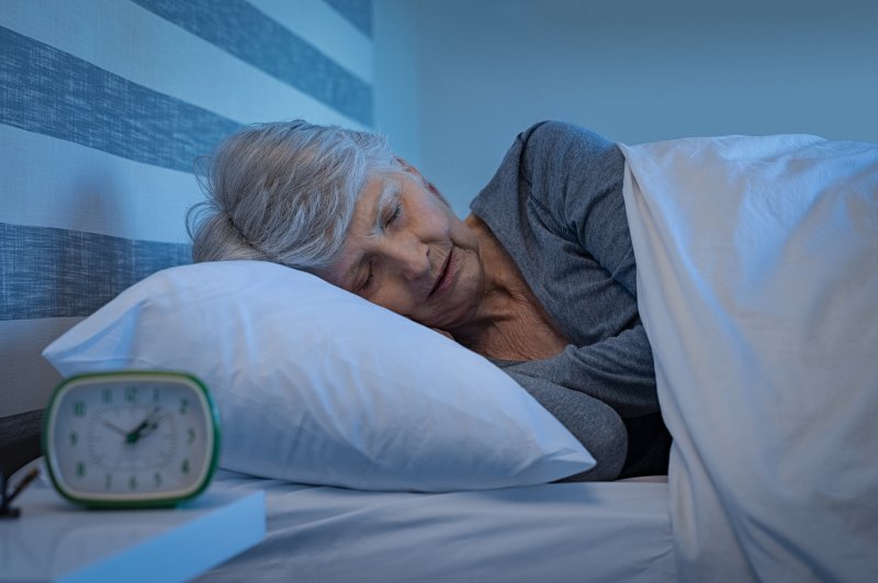 Older patient sleeping with their dentures